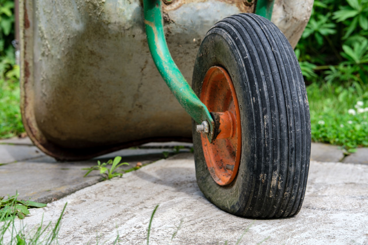 Wheelbarrow with deflated tyre